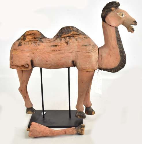 A Chinese carved wooden figure of a camel, northern Wei-Sui, some parts 300-500 AD with some more
