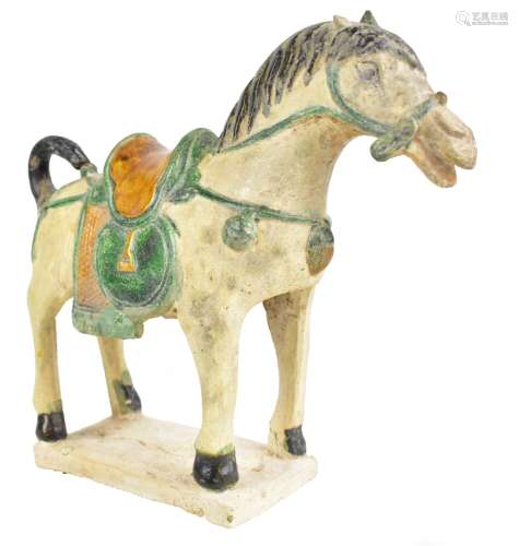 A Chinese sancai glazed pottery model of a saddled donkey, height 25cm, with label inscribed '