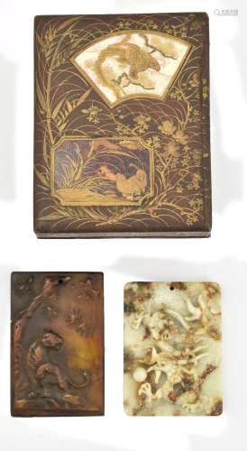 A Japanese Meiji period small lacquered rectangular box and cover, the lid set with two panels,