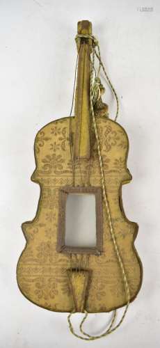 A photograph frame modelled as a violin with embroidered detail and tassel, length 60cm.