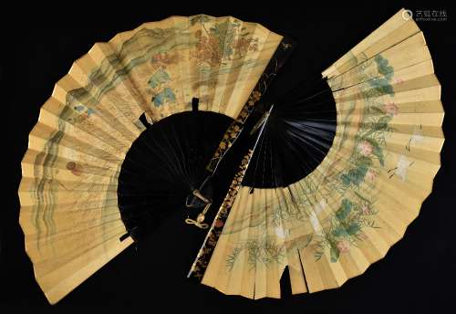Two late 19th/early 20th century Japanese lacquer and paper fans, both with gilt floral decoration