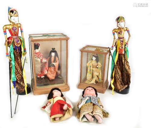Five Japanese dolls, three fitted in wooden display cases, height of larger case 35cm, also two