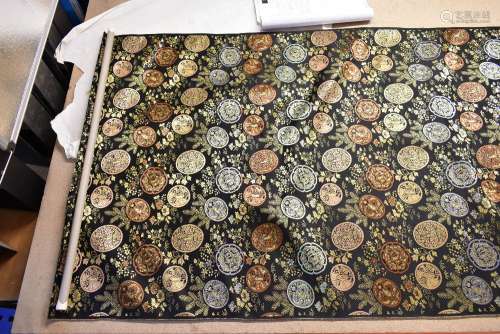 A selection of Japanese fabric including a large roll with gilded decoration depicting tsubas,