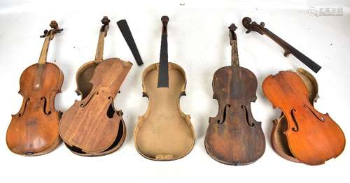 A box of mixed violins, bodies and parts.