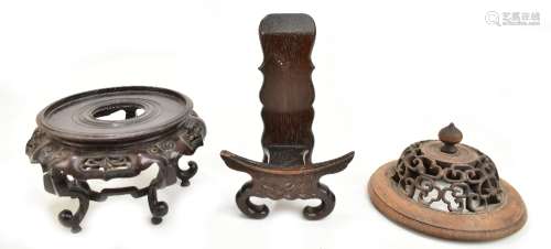 A Chinese rosewood plate stand with carved detail to the lower section, height 18cm, a further