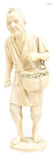 A good Japanese Meiji period carved ivory okimono of a farmer with basket of seed over his shoulder,