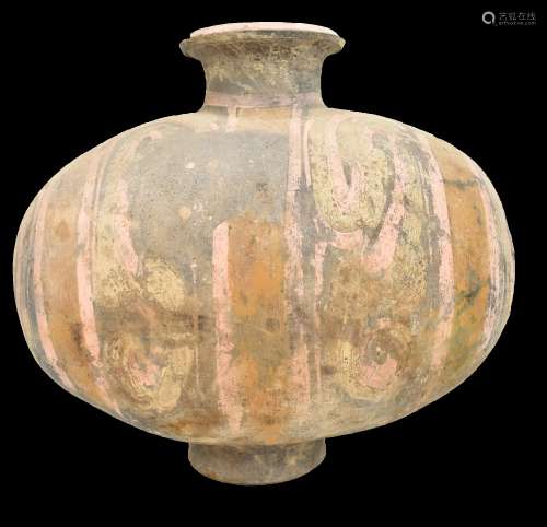 A Chinese Han dynasty earthenware cocoon vase with simple painted stylised detail on circular