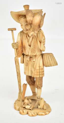 A Japanese Meiji period carved ivory okimono modelled as a crab catcher with basket holding egret,