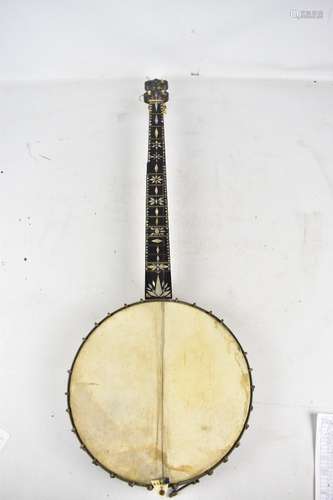 A late 19th/early 20th century open back five string banjo with mother of pearl inlay and ivory