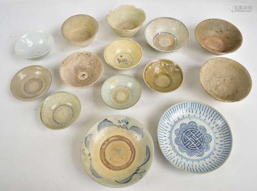A group of thirteen Chinese late Ming provincial earthenware bowls, some with simple painted