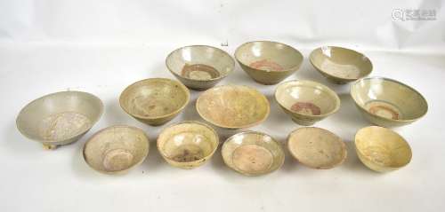 A group of thirteen Chinese late Ming provincial earthenware bowls and dishes, some with simple