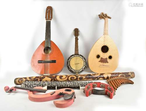 A mixed lot of assorted musical instruments including a modern lute, Spanish folk guitar,