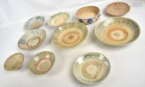 A group of ten Chinese late Ming provincial earthenware bowls and dishes, some with simple painted