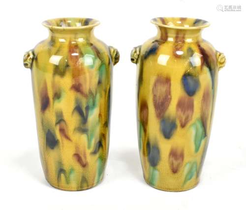 A pair of 19th century Chinese mottled tortoise shell glazed vases with applied masks beneath the