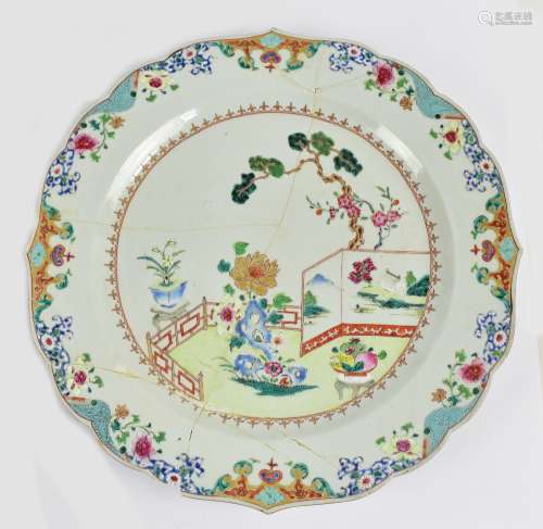 A late 18th/early 19th century Chinese Export charger with shaped rim, typical interior scene to