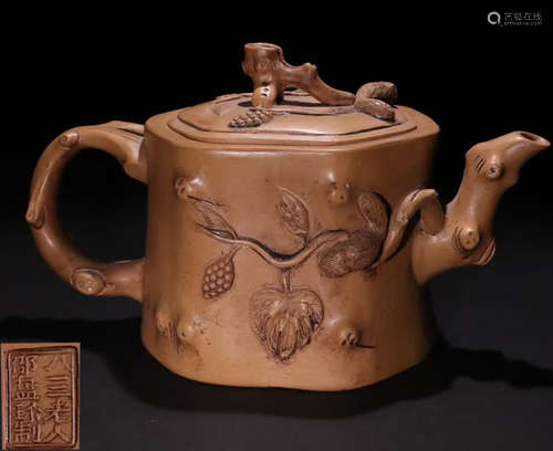 A ZISHA TEA POT CARVED WITH LEAVES