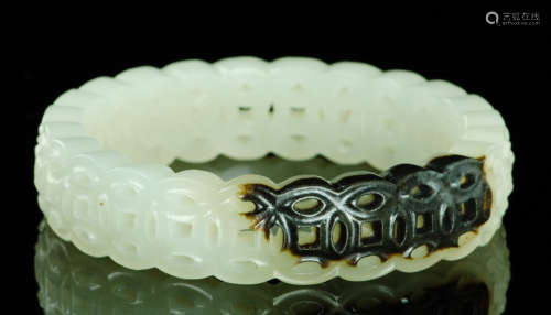 A JADE CARVED QIAN PATTERN BANGLE
