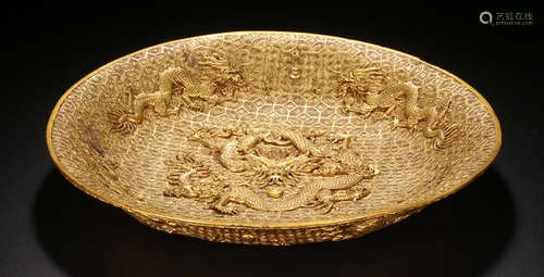 A LACQUER WOOD PLATE CARVED WITH DRAGON OUTLINE IN GOLD