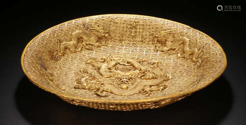 A LACQUER WOOD PLATE CARVED WITH DRAGON OUTLINE IN GOLD