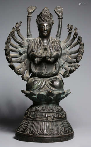 A COPPER BUDDHA STATUE WITH