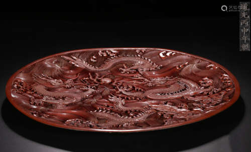 A RED LACQUER BOX CARVED WITH DRAGON PATTERN