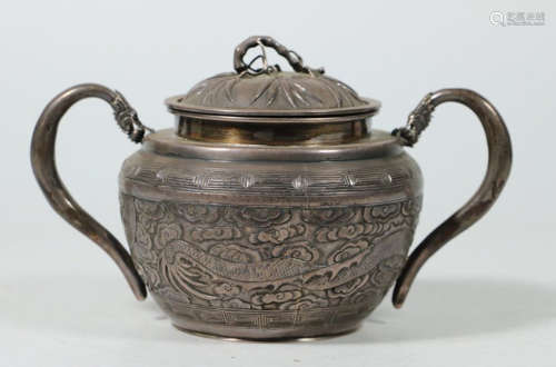 A SILVER JAR CARVED WITH DRAGON PATTERN