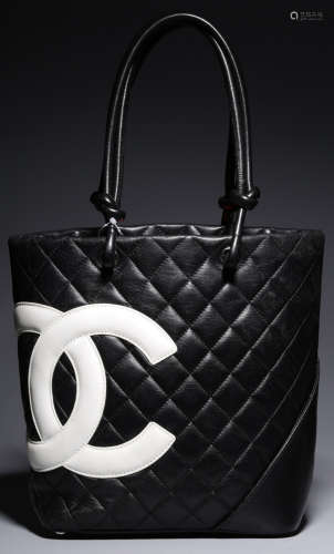 A CHANEL BLACK CALFSKIN SMALL HAND BAG