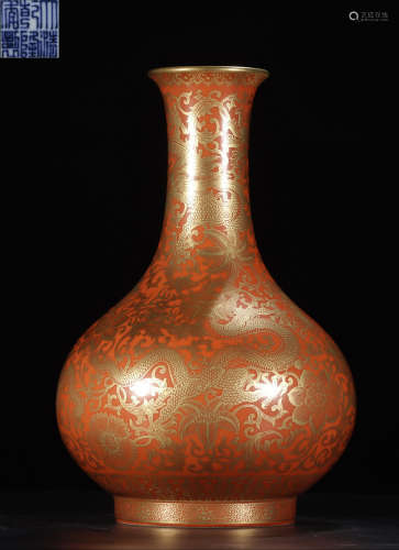 A RED GLAZE VASE WITH DRAGON PATTERN