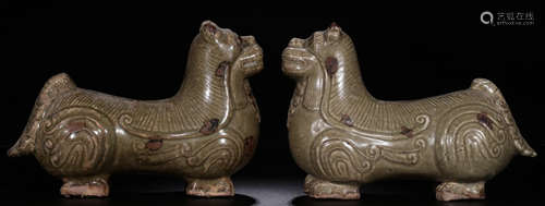 PAIR OF XIANGZHOU YAO CELADON GLAZE LION PENDANTS