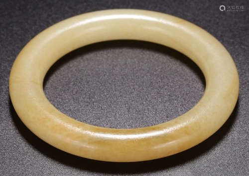 A XINJIANG HETIAN JADE CARVED BANGLE