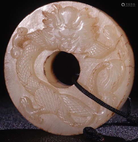 A HETIAN JADE CARVED DRAGON PATTERN PENDANT