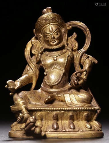 A GILT BRONZE CAST YELLOW JAMBHALA BUDDHA STATUE