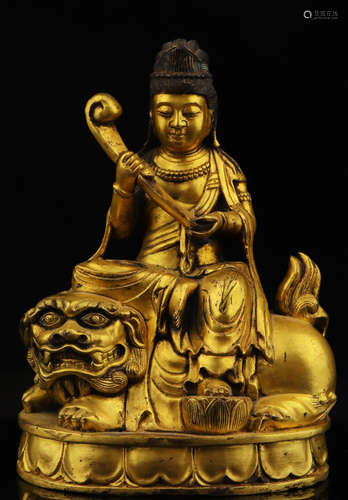 A GILT BRONZE CAST MANJUSRI STATUE