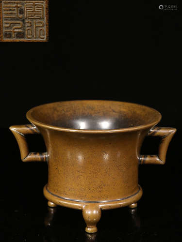 A COPPER CAST TRIPOD CENSER