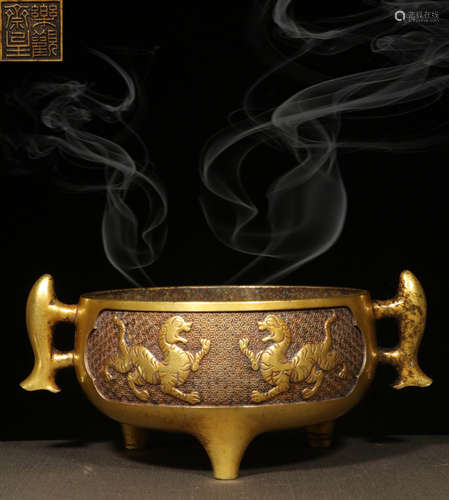 A GILT BRONZE CAST TRIPOD CENSER