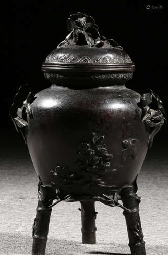 A COPPER CAST FLORAL PATTERN TRIPOD CENSER