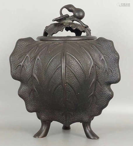 A COPPER CAST TRIPOD CENSER