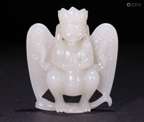 A VINTAGE WHITE JADE FIGURINE