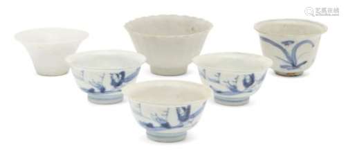 Six Chinese porcelain teabowls and a small dish, 18th - 19th century, painted in underglaze blue