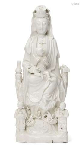 A large Chinese Dehua porcelain figure of Guanyin, 17th/18th century, Guanyin modelled seated on a