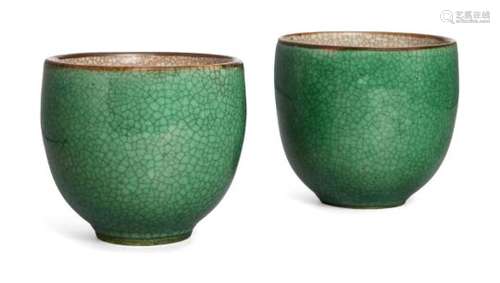 A pair of Chinese porcelain apple-green glazed cups, 18th century, the exterior covered with apple-