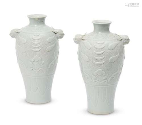 A pair of Chinese porcelain archaistic baluster vases, late Qing dynasty, the shoulder moulded