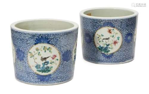 A pair of Chinese porcelain jardinières, late 19th century, painted in underglaze blue and famille