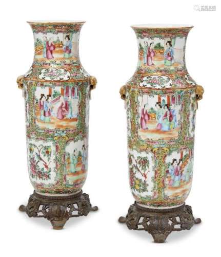 A pair of Chinese Canton vases, late 19th century, painted in famille rose enamels with panels of