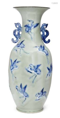 A large Chinese porcelain 'cranes' vase, 18th century, finely painted in underglaze blue and moulded