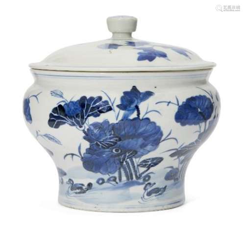 A Chinese porcelain jar and cover, 19th century, painted in underglaze blue with ducks in a lotus