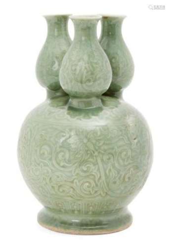 A Chinese porcelain celadon three-section vase, Republic period, moulded with flowering meandering