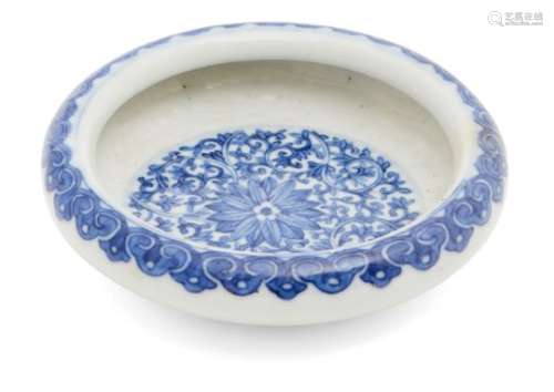 A Chinese porcelain circular brushwasher, Republic period, painted in underglaze blue with leafy