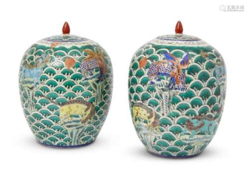 A pair of Chinese porcelain ovoid jars and covers, Republic period, painted in famille rose