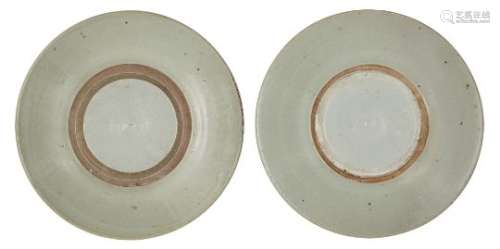 Two Chinese porcelain shallow dishes, Ming dynasty, 17th century, covered in a pale grey glaze, with